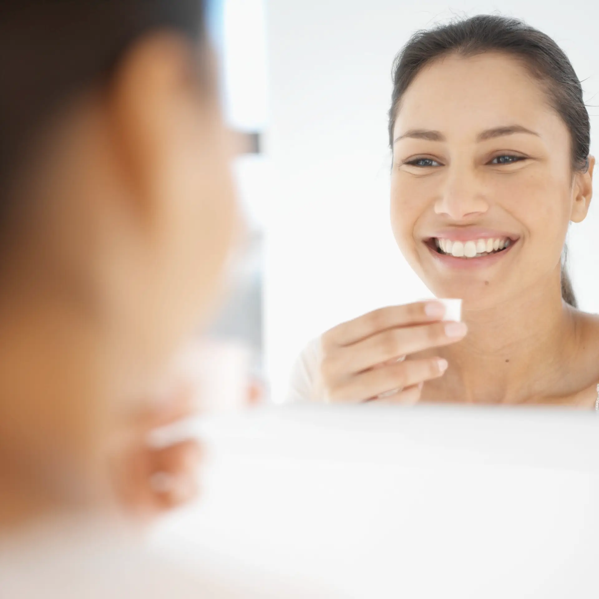 woman rinsing her mouth with mouthwash