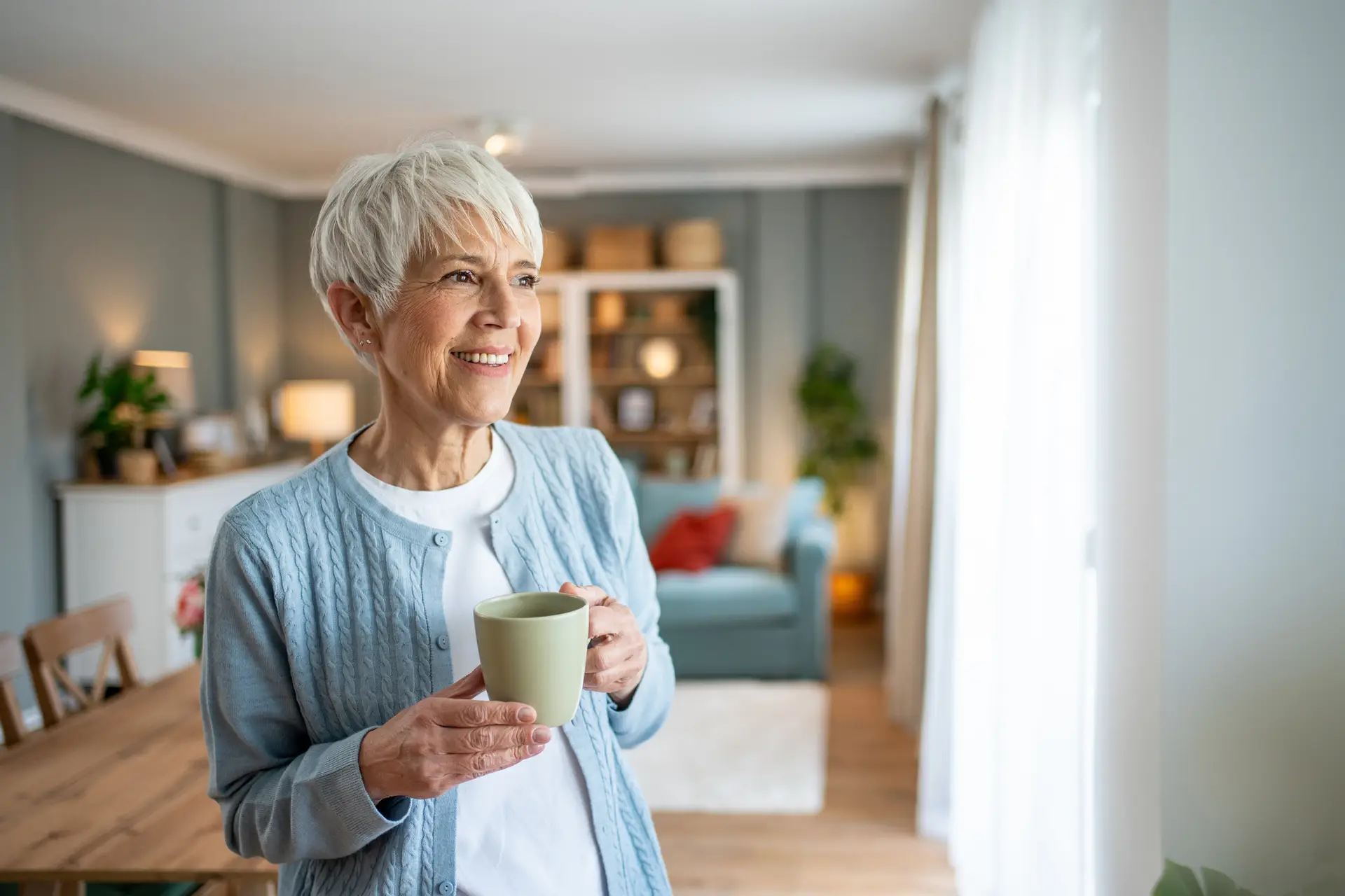 older woman drinking her morning coffee