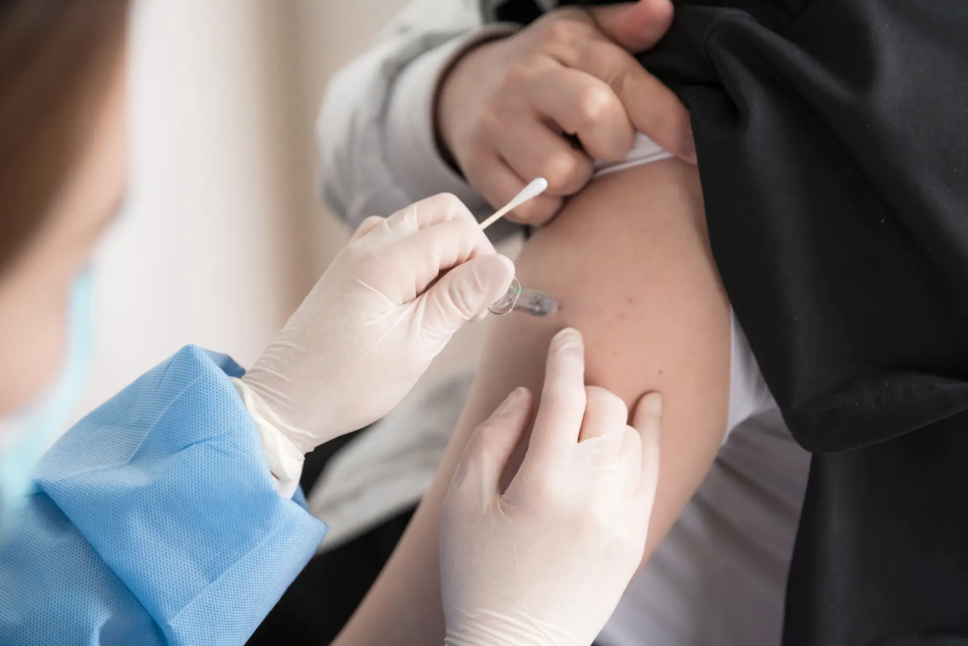 An adult is getting vaccinated
