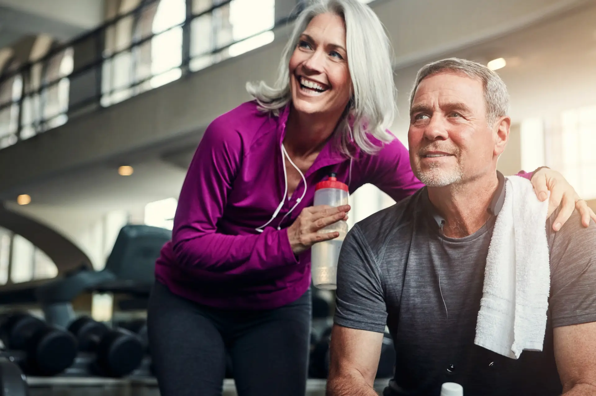 couple at a gym taking water break