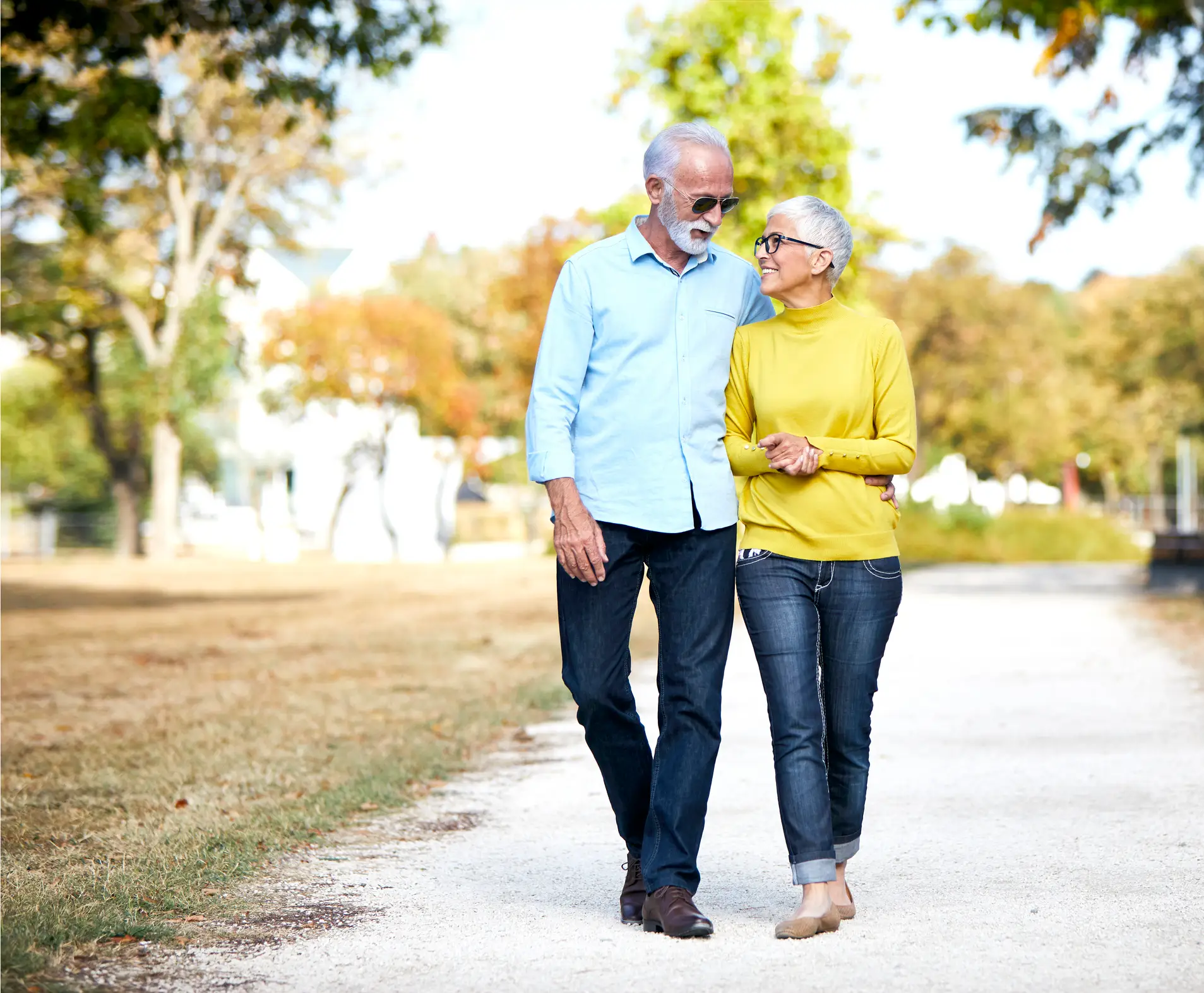 senior couple outside together on a path