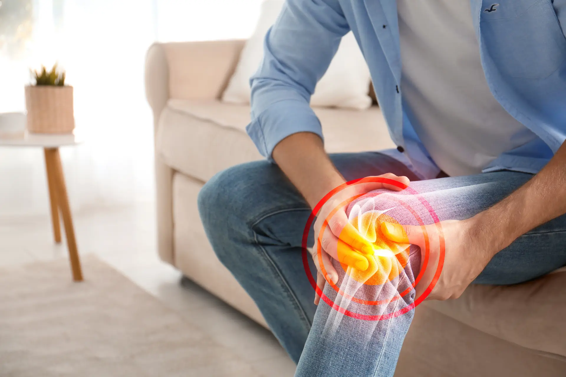 person holding knee in pain
