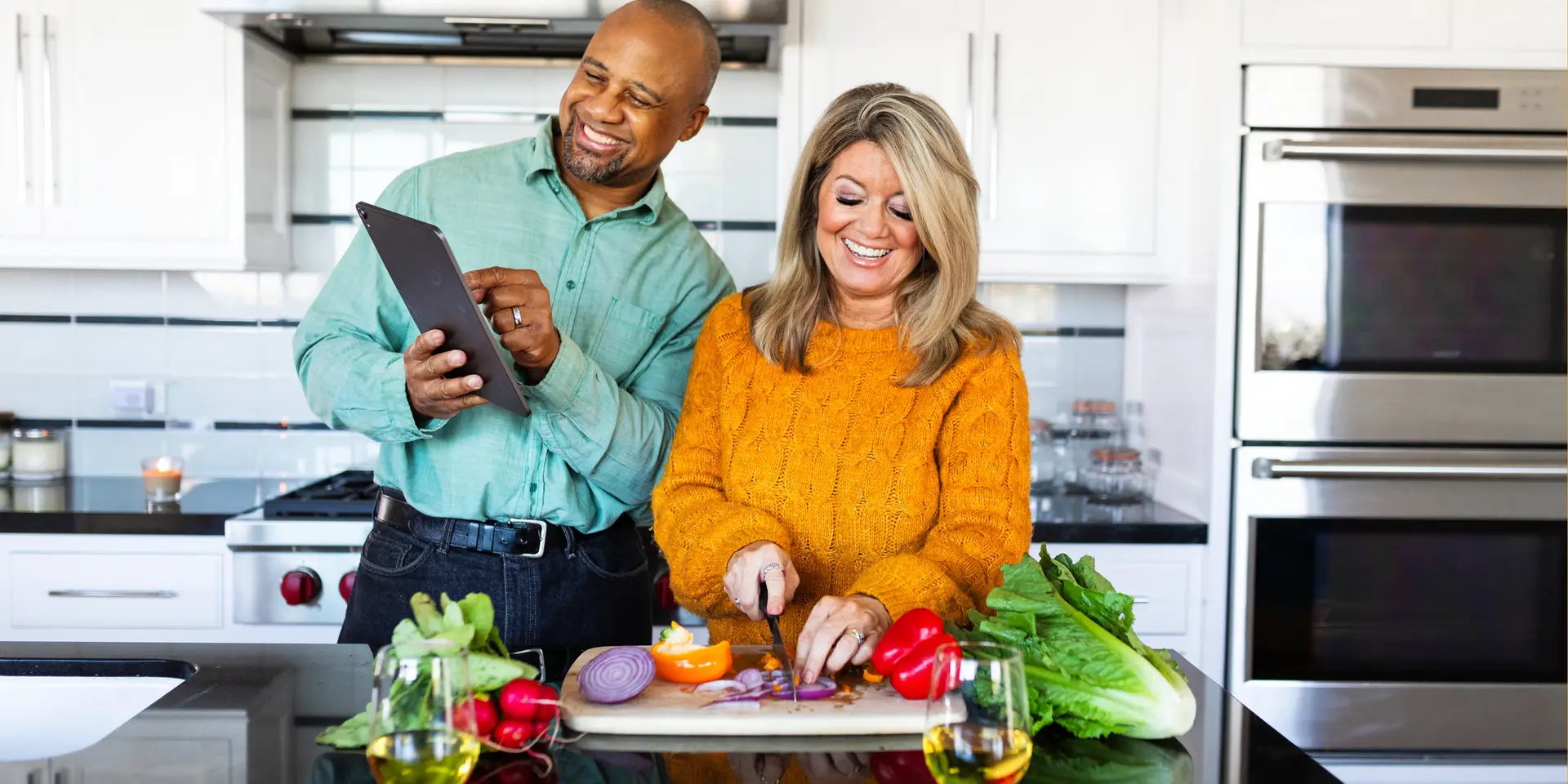 couple cooking together in modern kitchen
