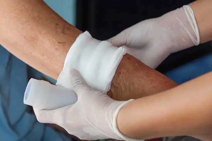 abrasion wound treatment on person